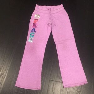 Old Navy girls sweatpants that say peace on it